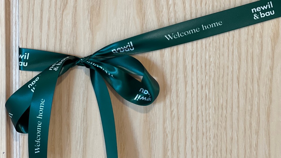 A silk Newil&Bau ribbon on the door.