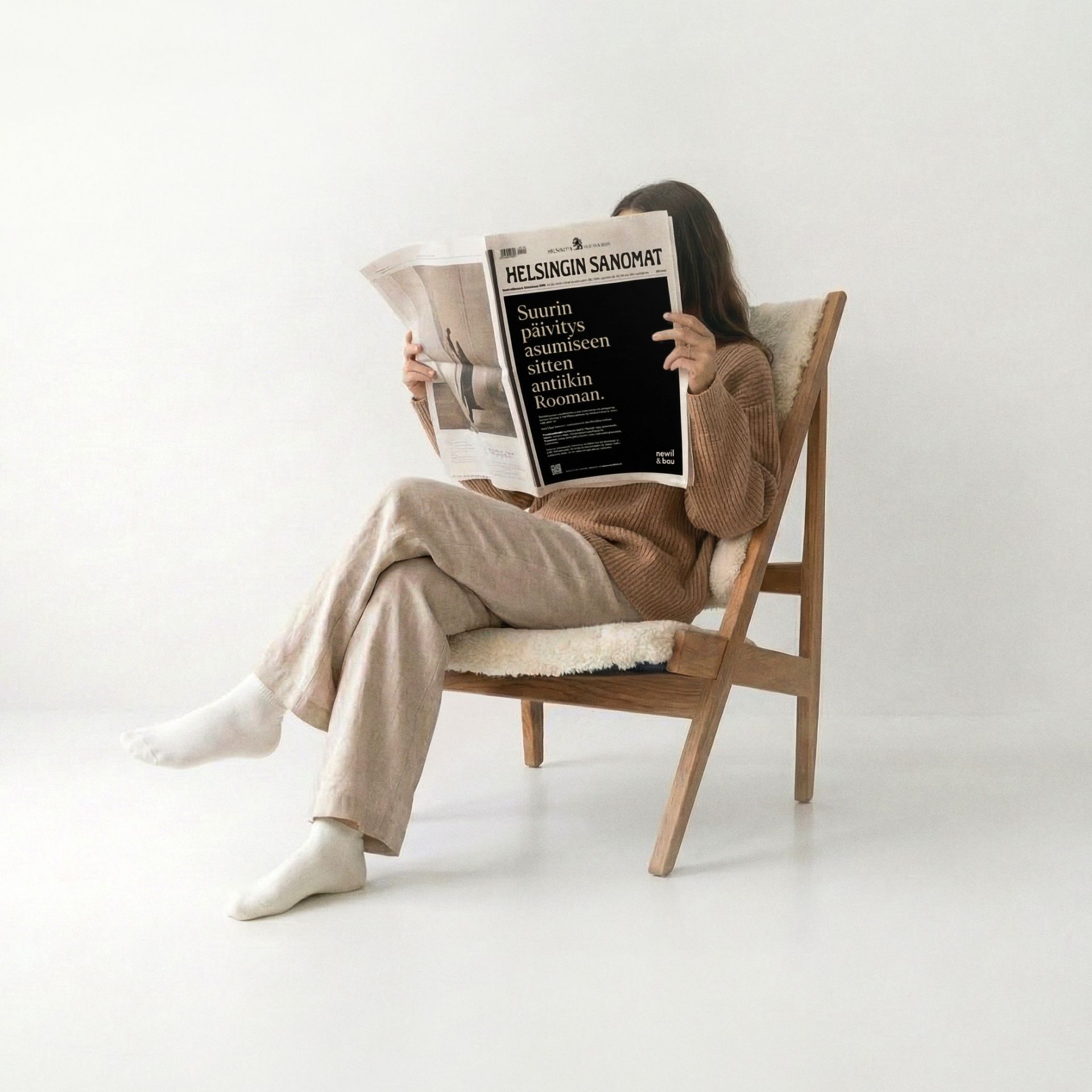 Woman reading magazine that has Gen2 launch in the front page